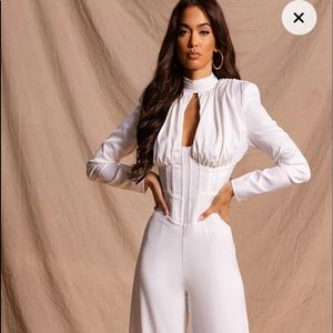White beautiful pant suit with corset waist and shoulder pads